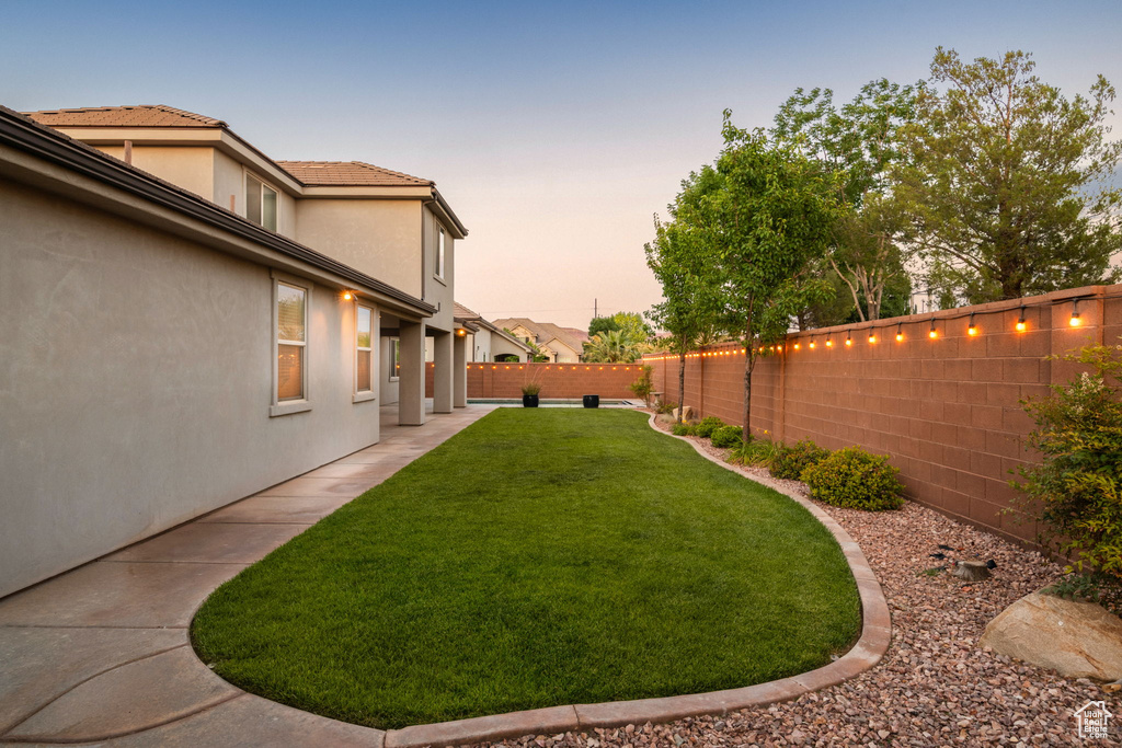 View of yard with a patio area