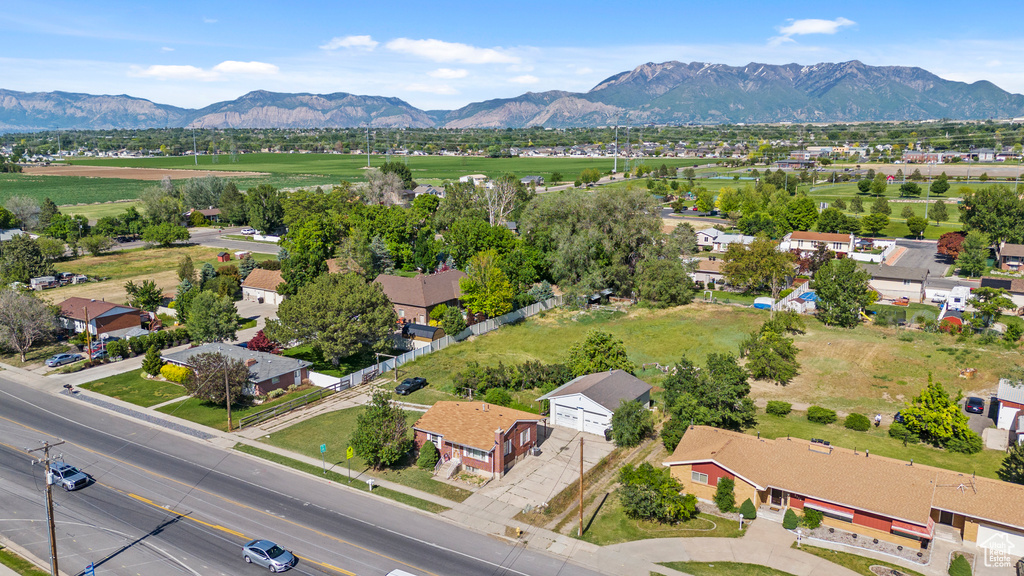 Aerial perspective of suburban area featuring a mountain backdrop
