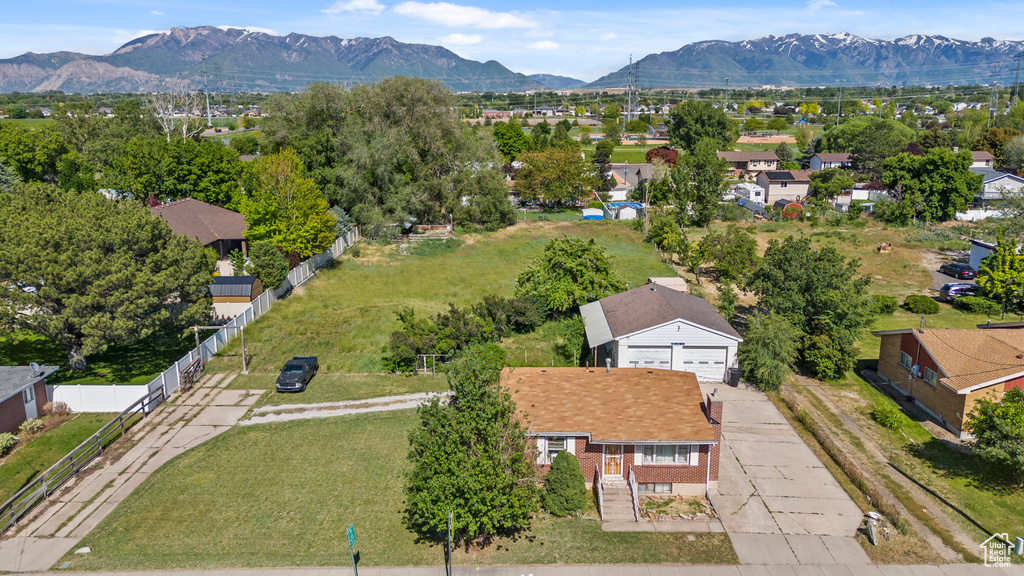 Aerial perspective of suburban area with a mountainous background