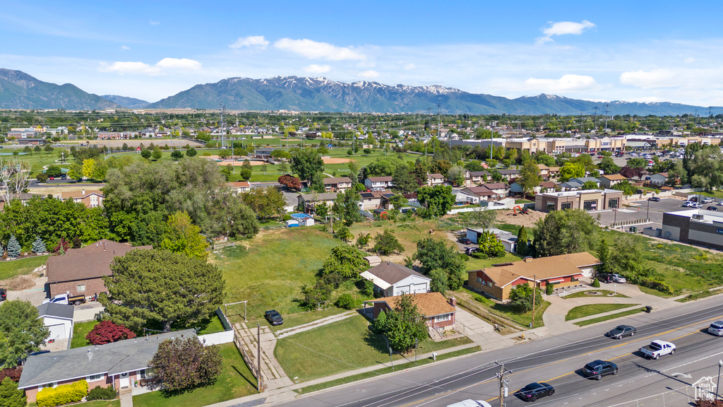 Aerial perspective of suburban area featuring a mountain backdrop