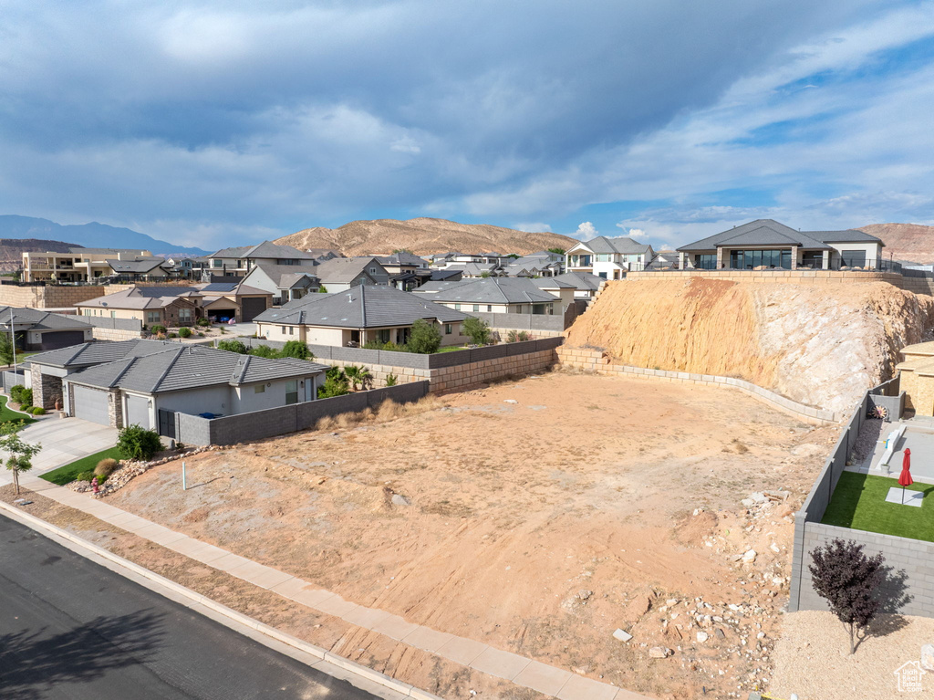 View of mountain backdrop featuring nearby suburban area