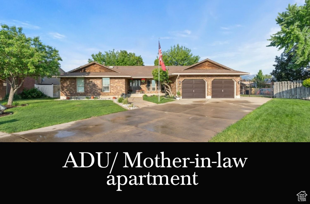 Single story home featuring an attached garage, concrete driveway, and brick siding