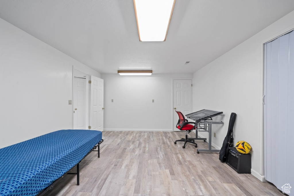 Office with wood finished floors and baseboards