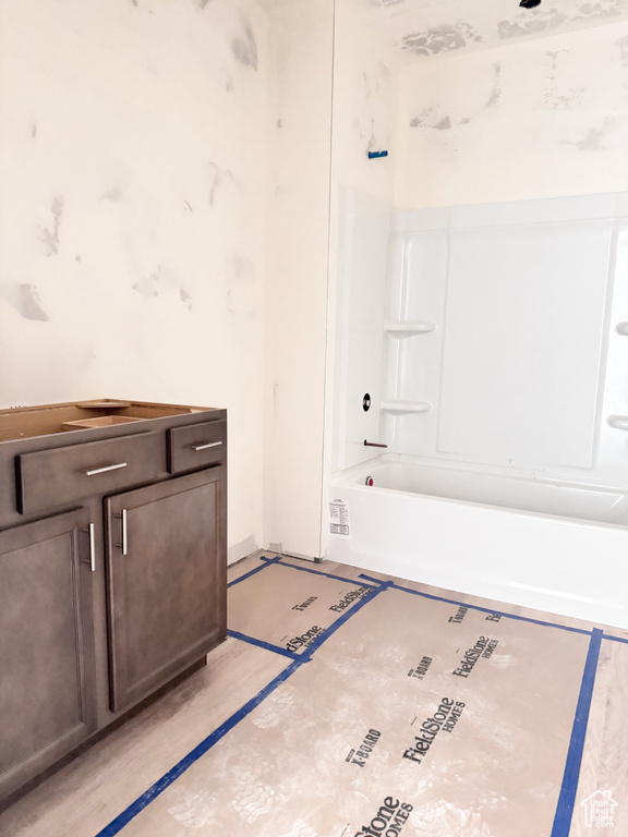 Bathroom featuring shower / bathtub combination and vanity