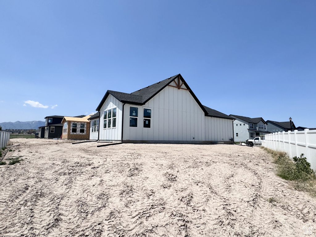 Back of property featuring board and batten siding