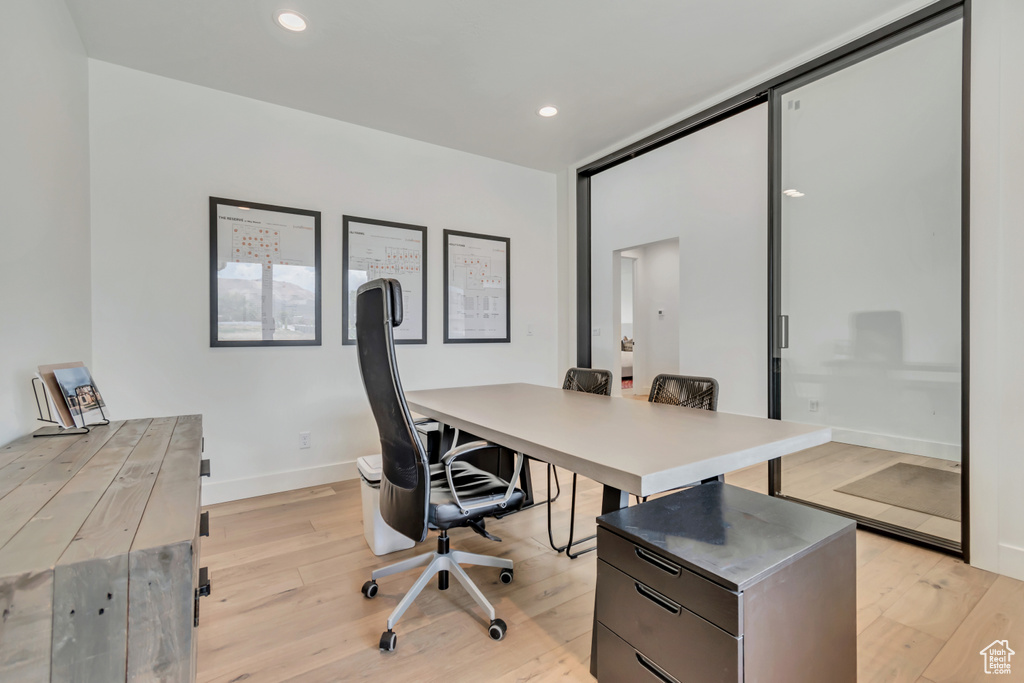 Home office with light wood-type flooring, recessed lighting, and baseboards