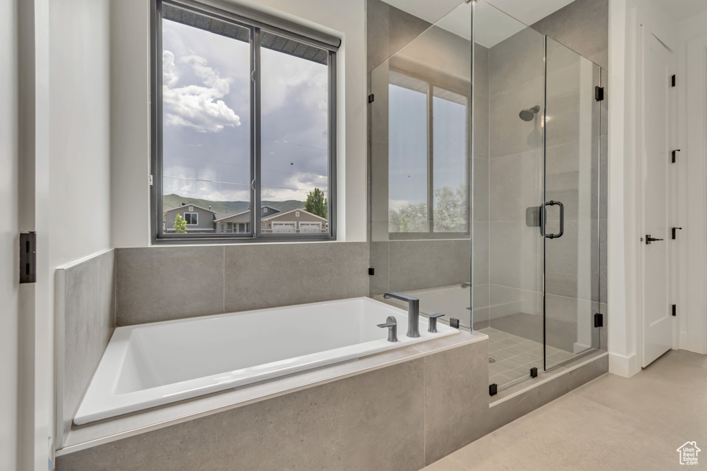 Bathroom with a garden tub and a shower stall