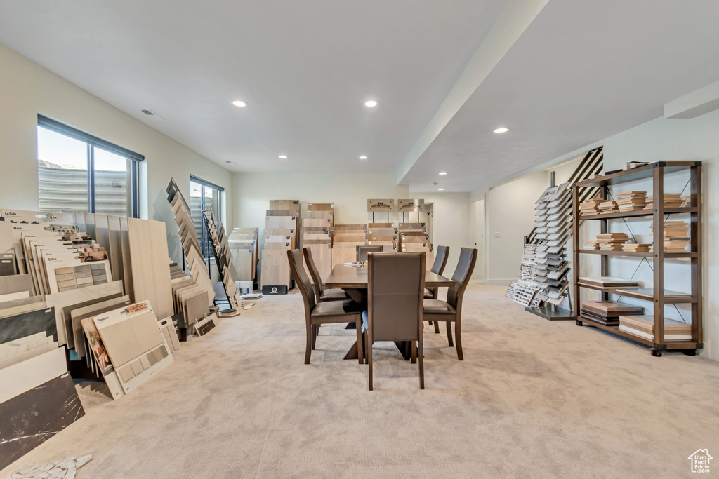 Dining room featuring light colored carpet, recessed lighting, and baseboards