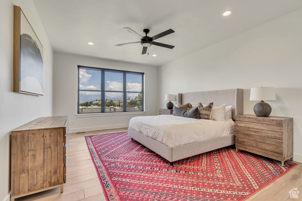 Bedroom featuring light wood-type flooring, recessed lighting, baseboards, and a ceiling fan