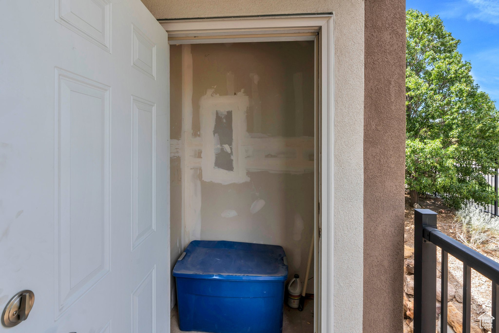 Property entrance with stucco siding