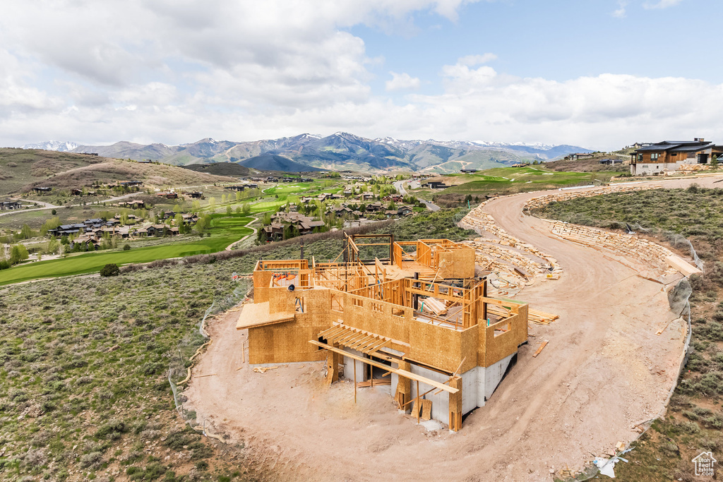 View of property's community with a deck with mountain view