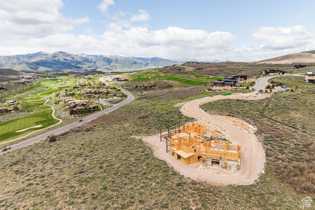 Aerial view of a mountainous background and a golf club