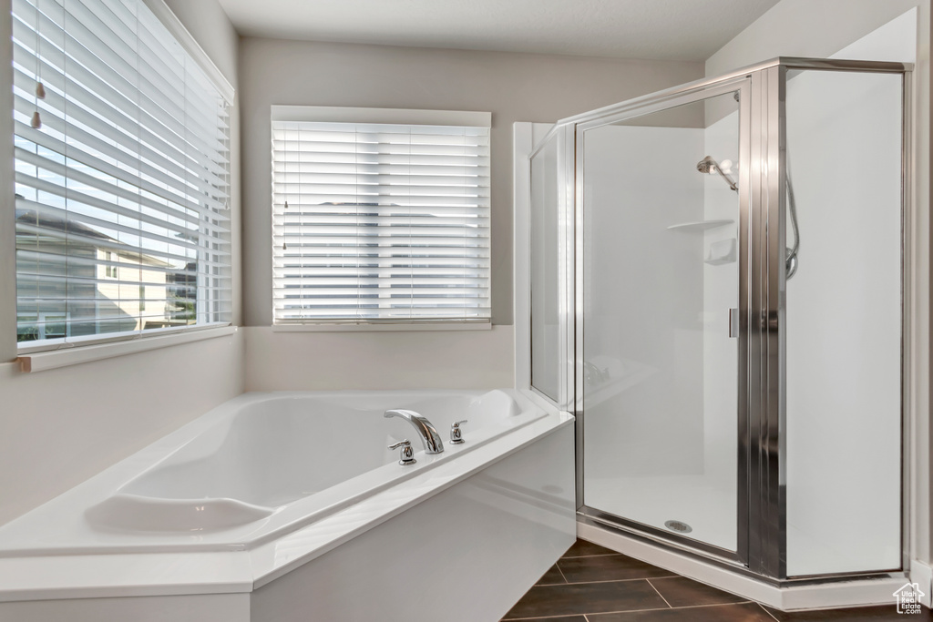 Full bathroom with a stall shower and a garden tub