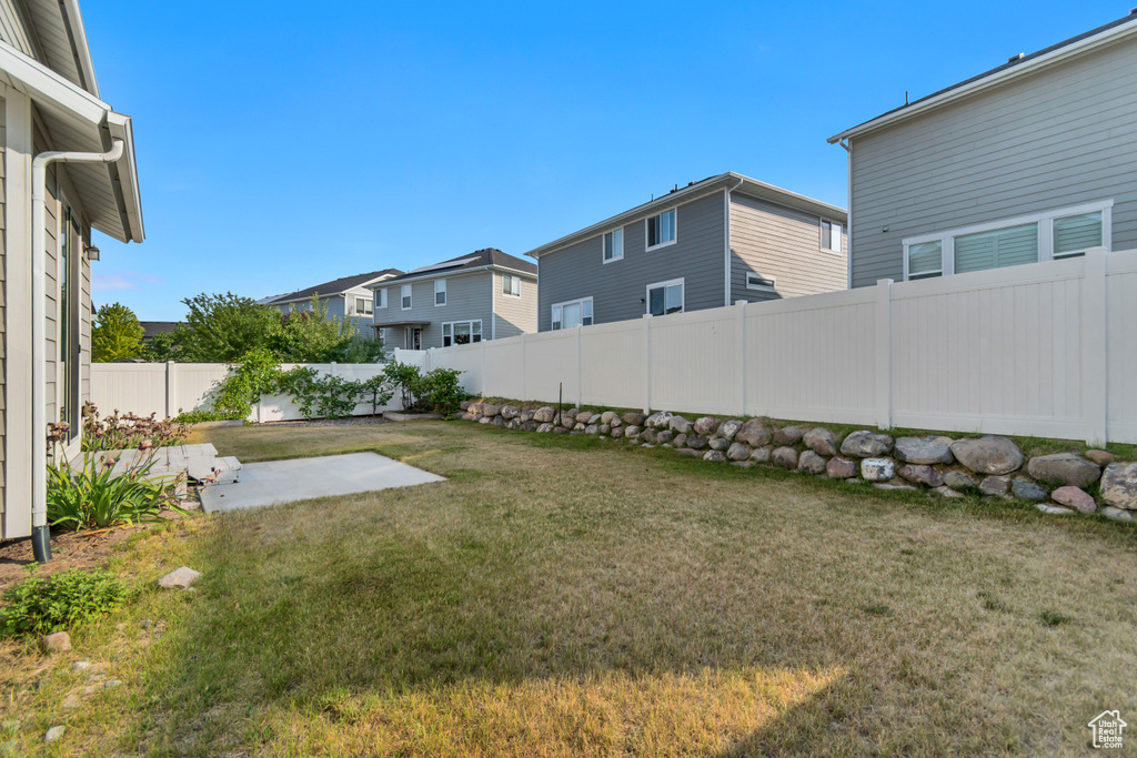 View of yard with a residential view and a patio