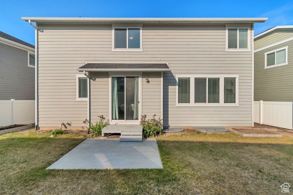 Back of property featuring a patio area