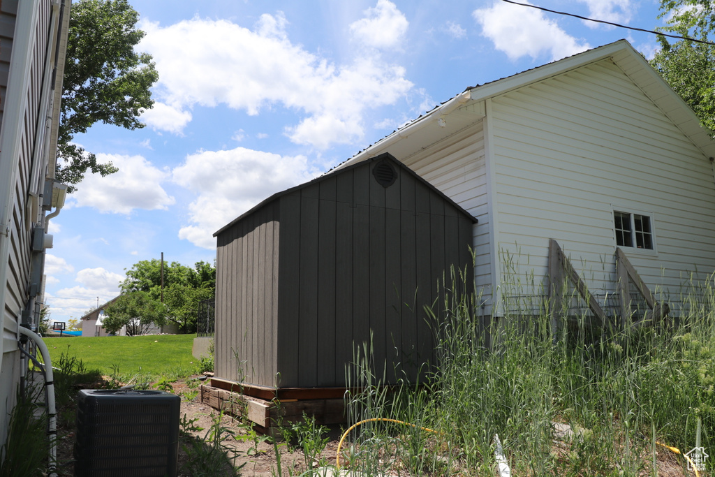 View of outdoor structure with central air condition unit