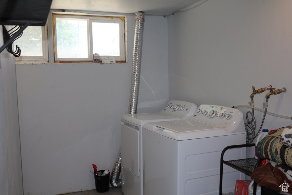 Washroom featuring washer and clothes dryer