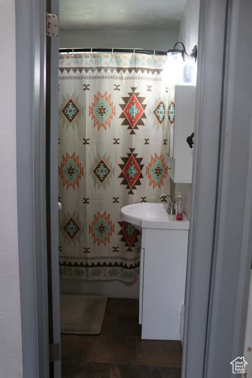 Bathroom featuring vanity and a shower with curtain