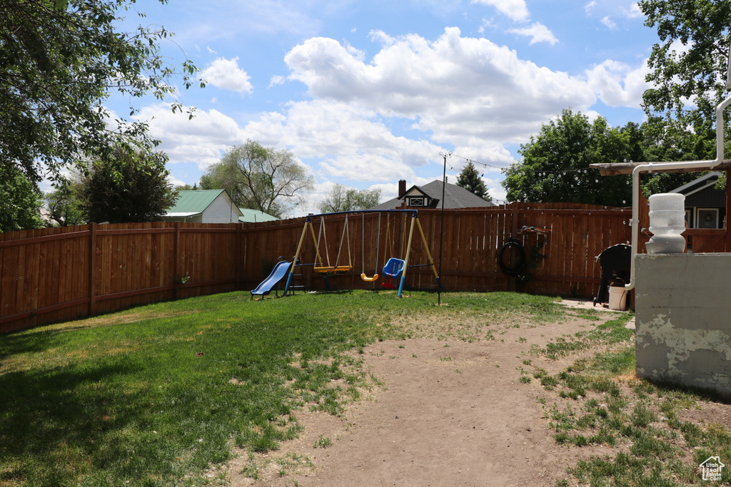 View of yard with a playground