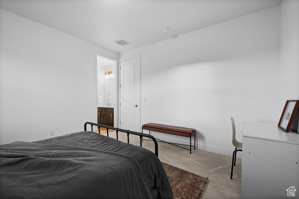 Bedroom with carpet and baseboards