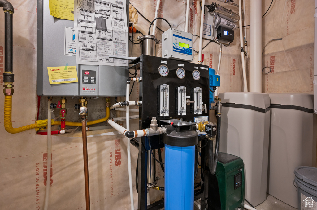 Utility room featuring tankless water heater