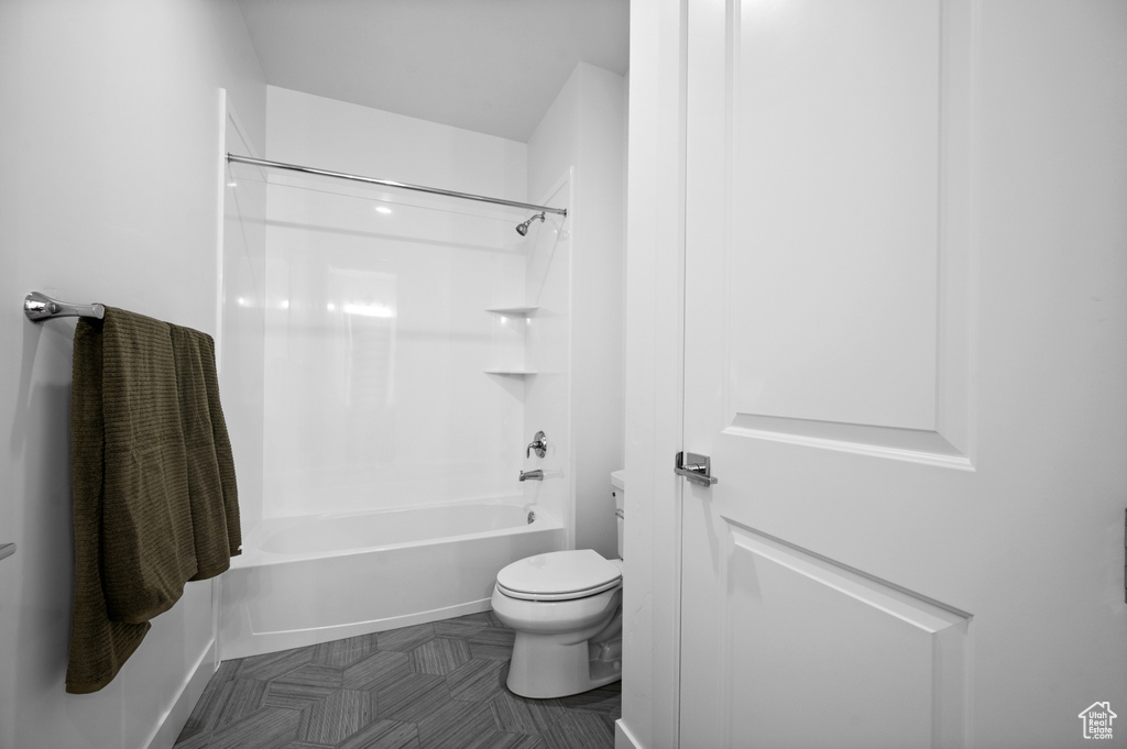 Full bathroom featuring toilet and shower / tub combination
