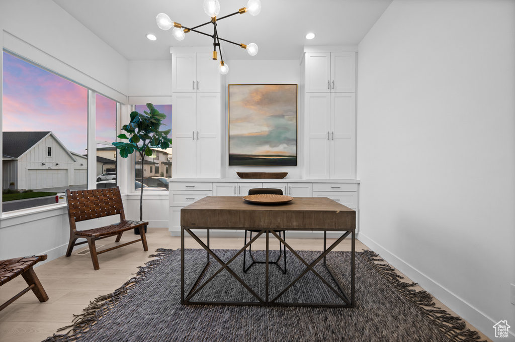Home office with a chandelier, light wood finished floors, recessed lighting, and baseboards