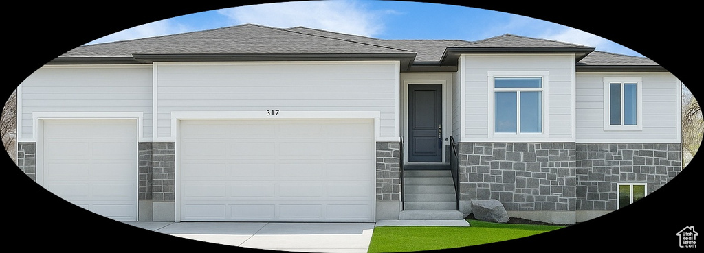 View of front of property featuring stone siding and entry steps