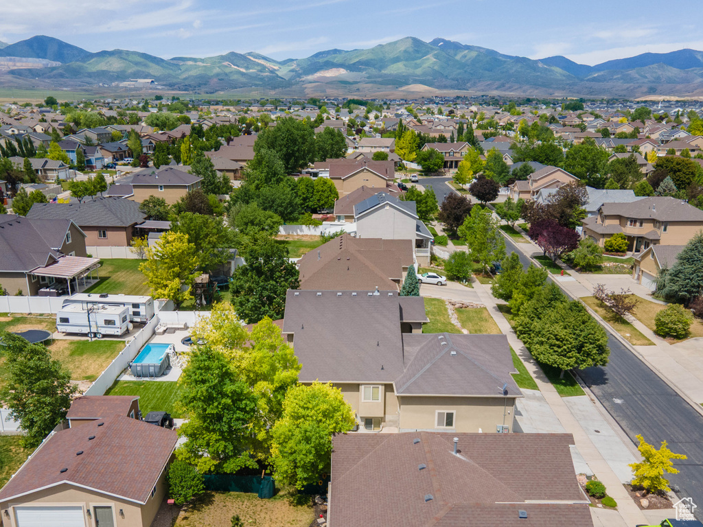 Aerial view of residential area featuring mountains