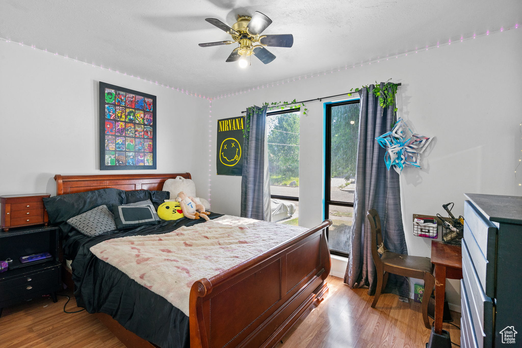 Bedroom featuring wood finished floors and a ceiling fan