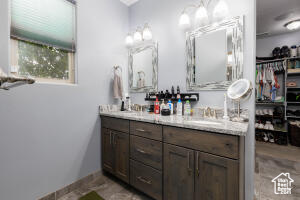 Full bath featuring double vanity