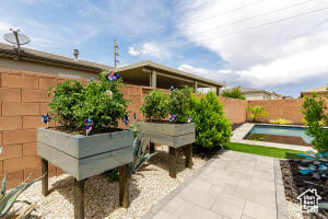 Fenced backyard featuring a patio