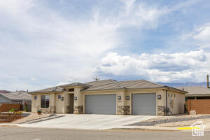 Prairie-style home with a garage and concrete driveway