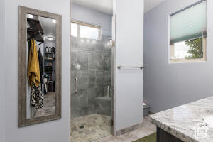 Bathroom featuring vanity and a stall shower
