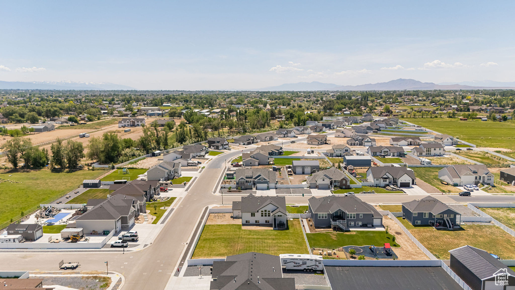 Aerial perspective of suburban area featuring a mountain backdrop