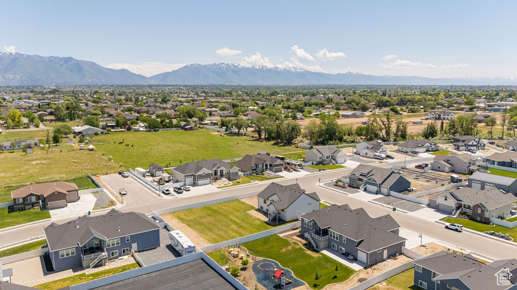 Aerial perspective of suburban area featuring a mountain backdrop