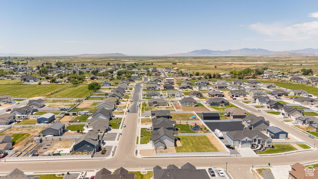View of property location featuring a mountain backdrop and nearby suburban area