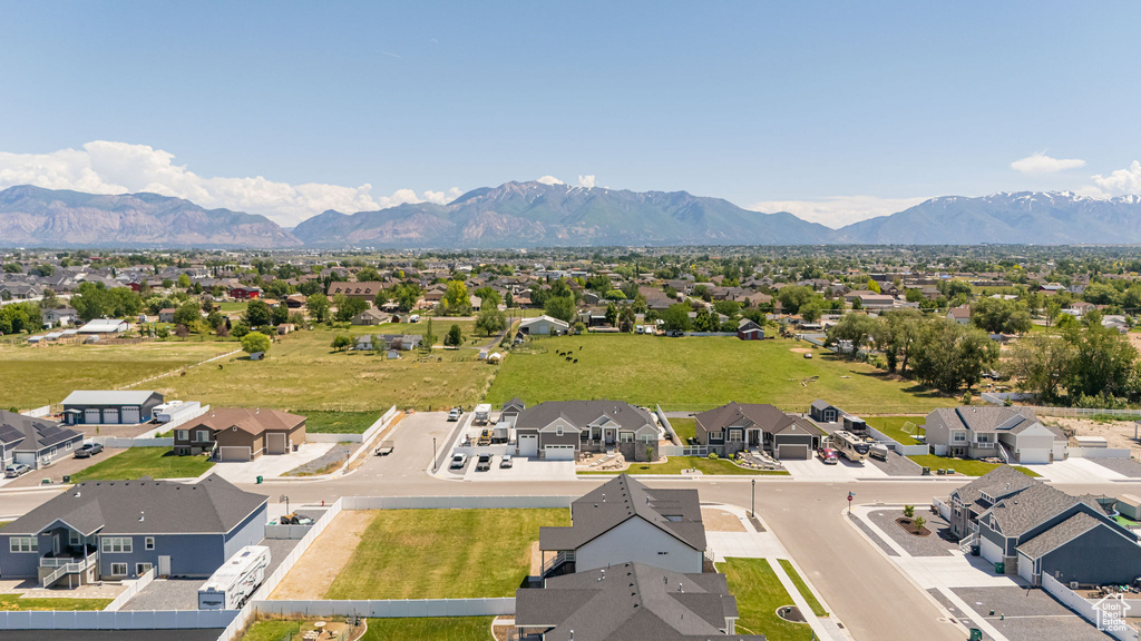 Aerial perspective of suburban area with a mountainous background