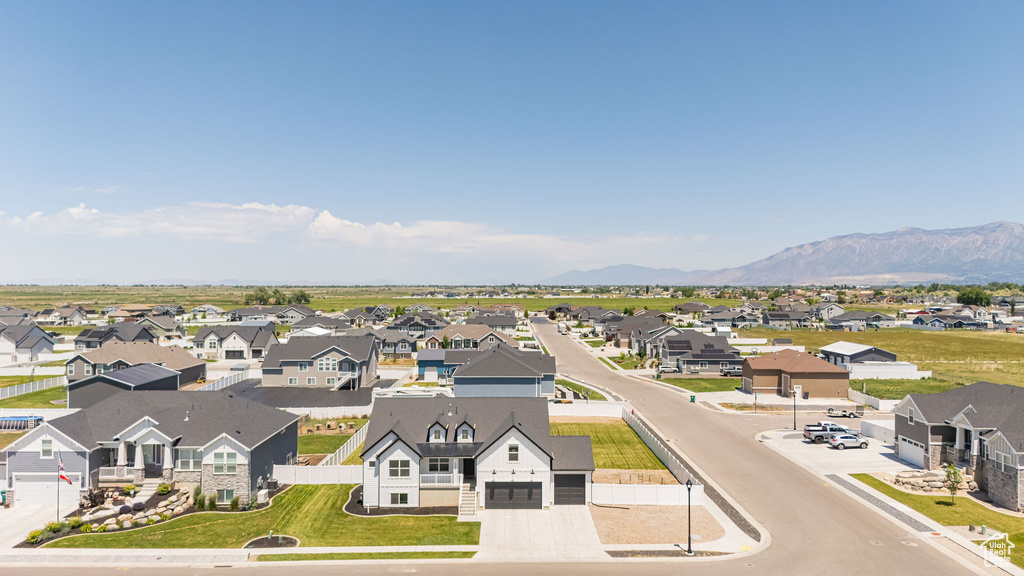 Aerial view of residential area featuring mountains