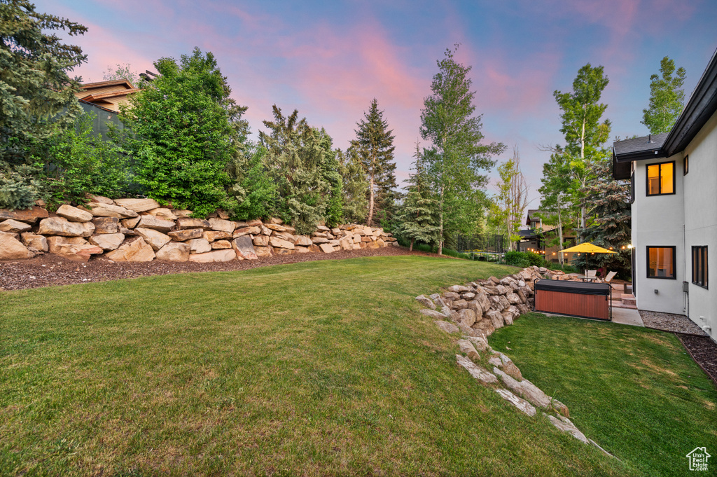 View of yard with a hot tub