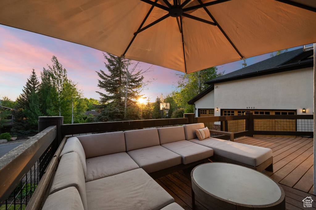 Deck at dusk with an outdoor hangout area