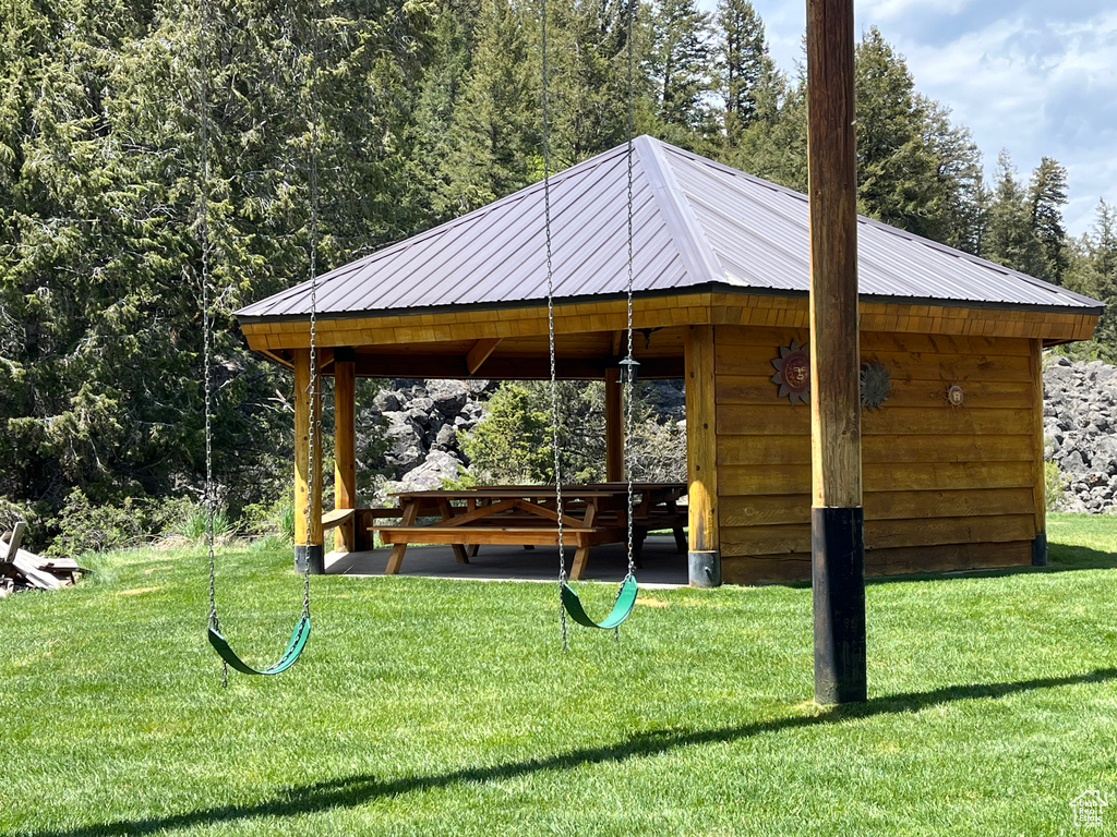 Surrounding community with a gazebo and a lawn
