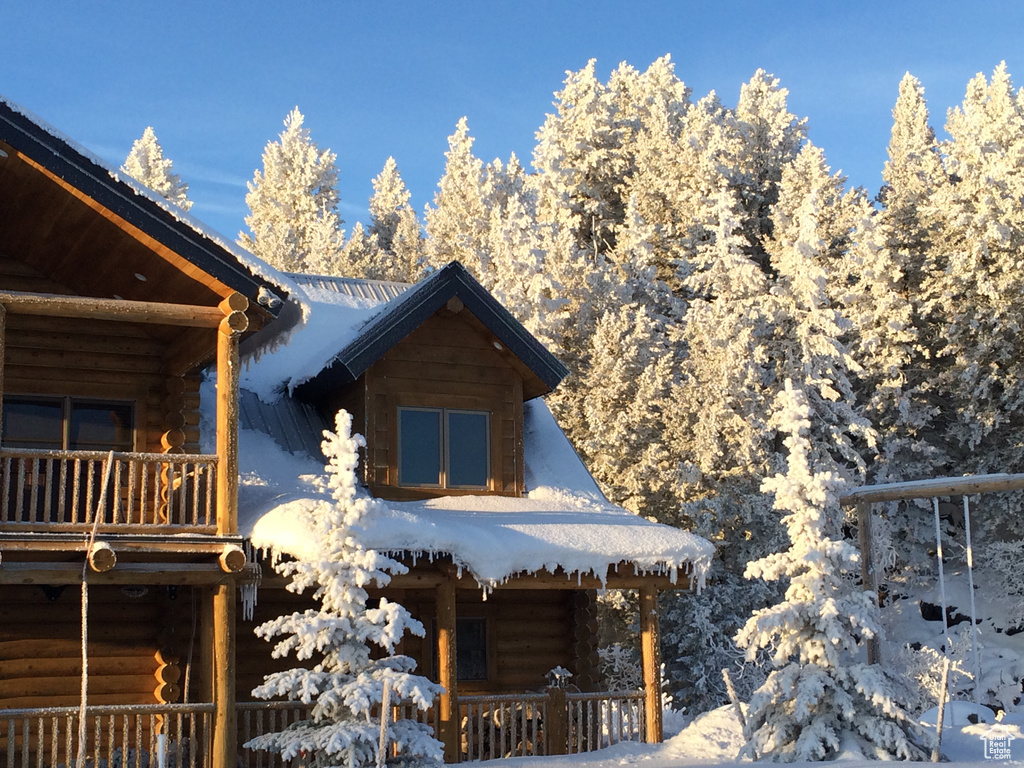 View of front of house with log exterior