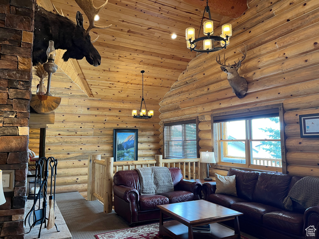 Living area with a chandelier, rustic walls, wooden ceiling, high vaulted ceiling, and carpet