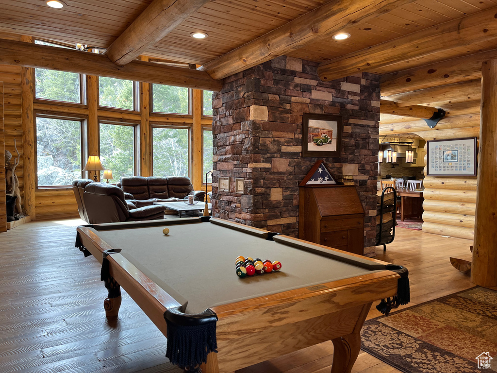 Rec room featuring rustic walls, light wood finished floors, wood ceiling with exposed beams, billiards table, and recessed lighting