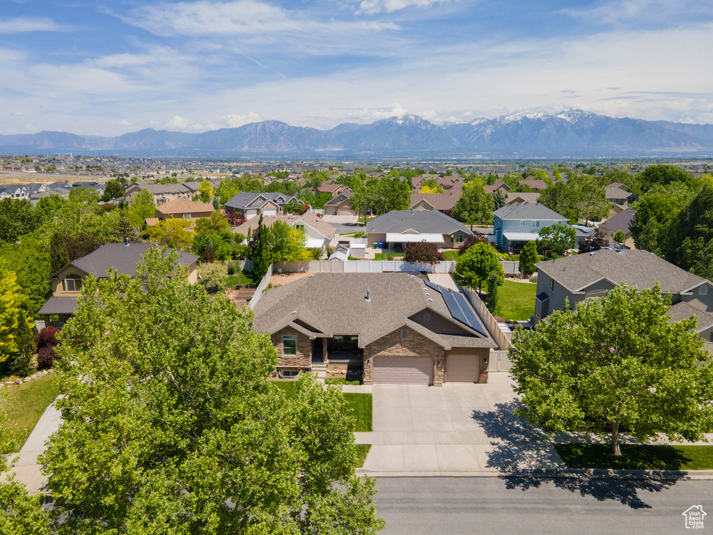 Aerial perspective of suburban area featuring a mountain backdrop