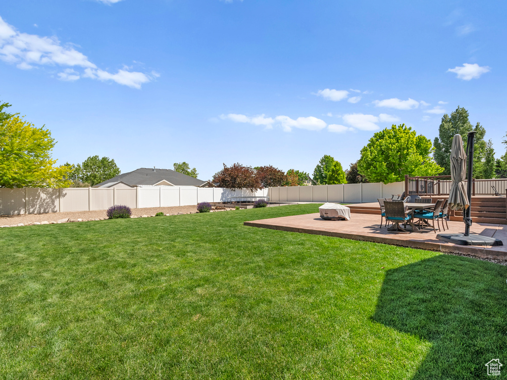 View of yard with a deck