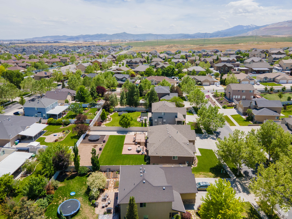 Aerial view of residential area featuring mountains