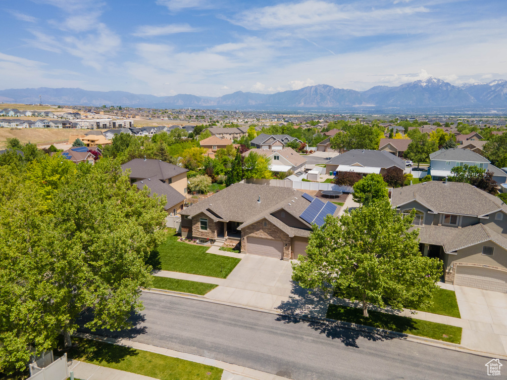 Aerial perspective of suburban area with a mountainous background