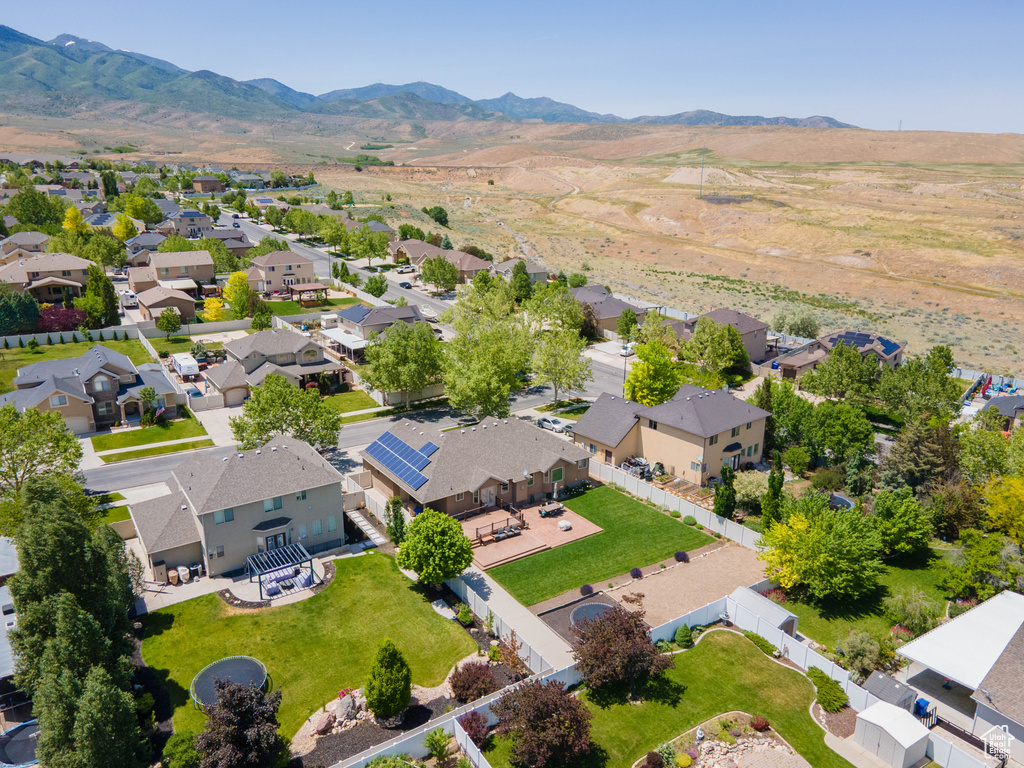 Aerial perspective of suburban area featuring a mountainous background